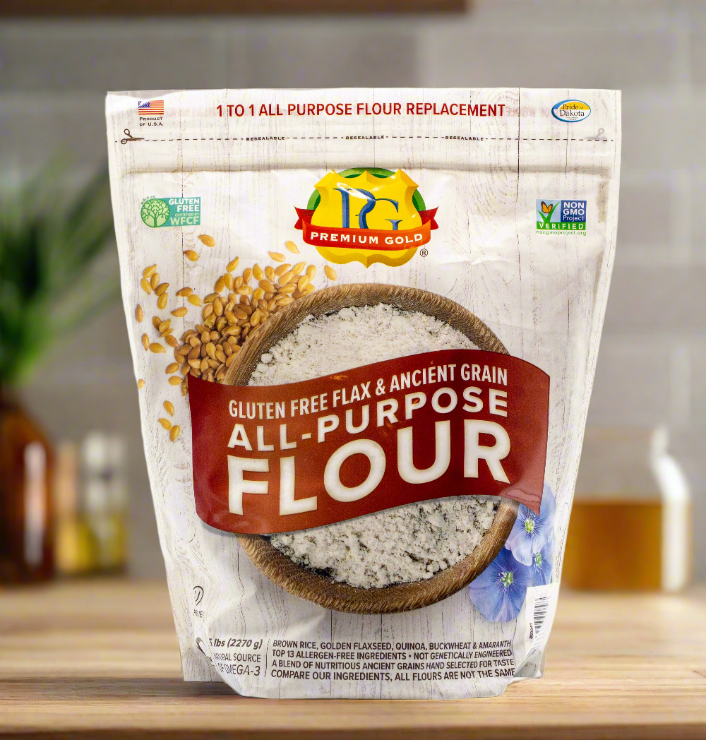 Two packages of Premium Gold gluten-free all-purpose flour, one old and one new package design