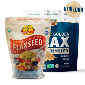 Two packages of Premium Gold Organic Golden Flaxseed with different designs on a white background