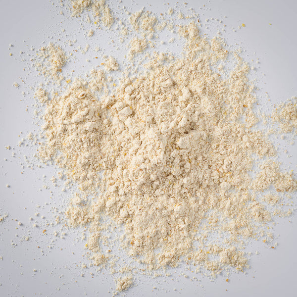 a heap of gluten free all purpose flour on a gray background